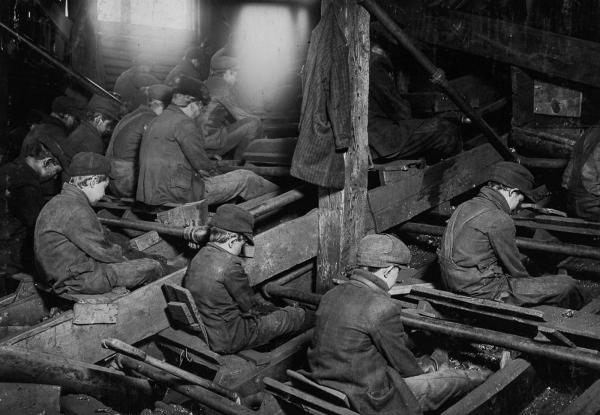  Breaker boys at work breaking coal. Clouds of dust coat the workers’ lungs- 1911credit to Lewis Hine