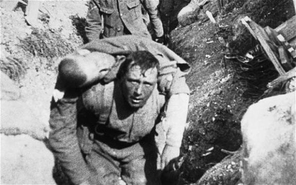 A soldier rescuing a comrade at The Battle Of The Somme