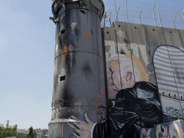 Banksy: President Donald Trump kissing an Israeli army watchtower in West Bank
